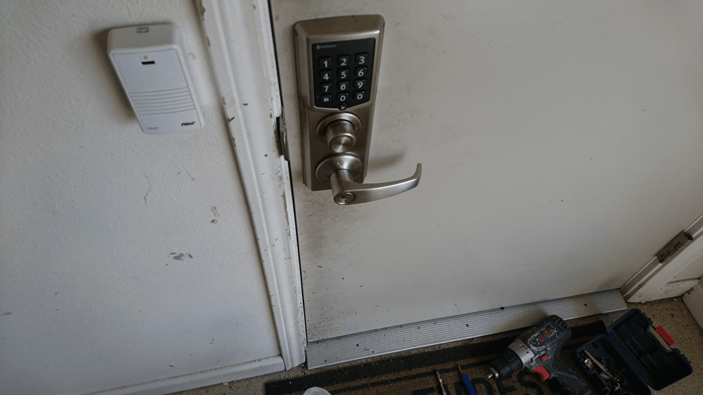 Residential door lock and keypad hardware in a calm home entry