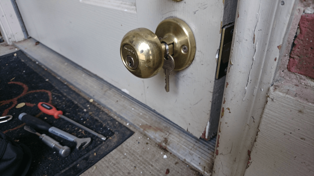 House key partly stuck in a residential door lock