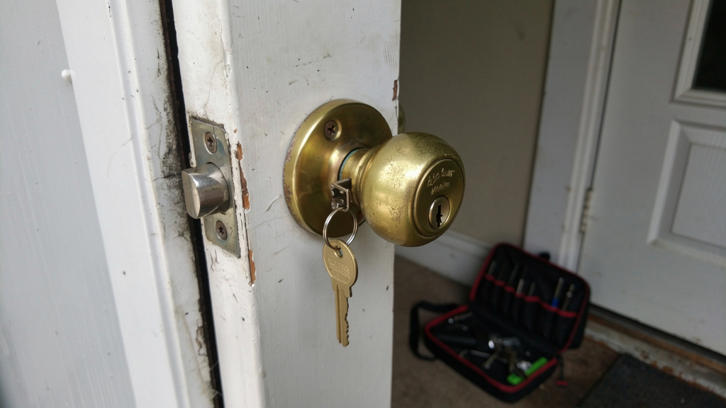 Short house key partly stuck in a normal-height residential deadbolt