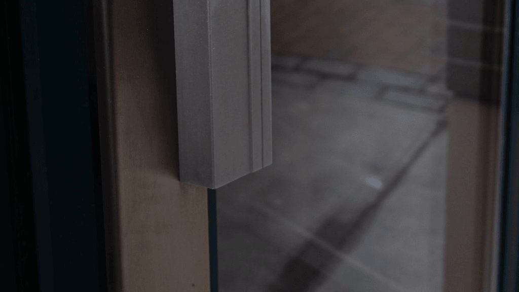 Real glass office-entry door and metal pull handle