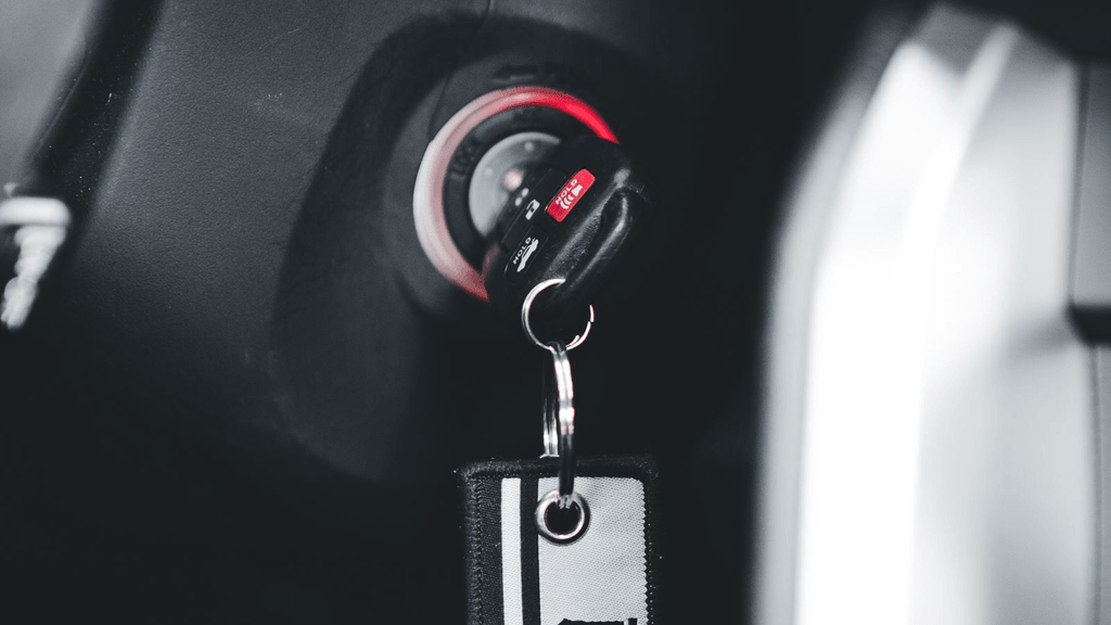Real vehicle key inserted in an ignition cylinder
