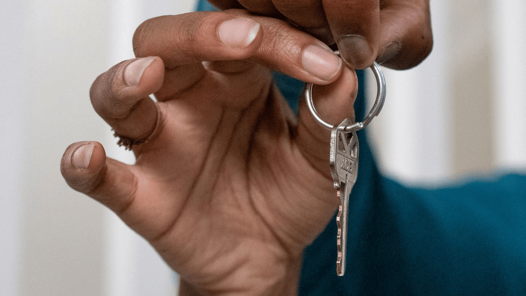Real house keys being handed to a new resident